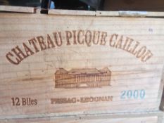 Chateau Picque Caillou Pessac-Leognan 2000
Nine bottles in old wooden case.  (9)   CONDITION