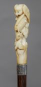 A 19th century Japanese carved ivory handled walking stick
The handle carved with an owl and its