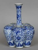 A Chinese blue and white porcelain crocus vase
Of typical form, decorated with lotus strapwork and