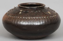 An 18th century South Indian jardiniere
With a brown mottled glaze and with small floral