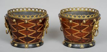 A pair of Continental geometrically inlaid amboyna jardineres
Each with a pierced ormolu gallery and