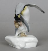 A 20th century Meissen porcelain figure of a preening penquin
Blue painted crossed swords mark,