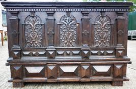 A 16th/17th century German coffer on stand
Of oak and pine construction with carved decoration (