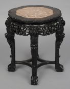A 19th century Chinese marble inset carved hardwood side table
The shaped bead moulded top above
