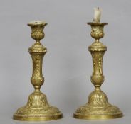 A pair of French bronze candlesticks
Cast with acanthus leaves and fruiting laurel.  31.5 cms high.