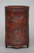 A 19th century Chinese bamboo brush pot
Carved with a bird amongst foliage, carved seal mark of