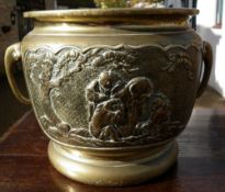 A Chinese bronze jardiniere
With elephant mask handles, the sides decorated with vignettes of