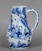 A late 17th/early 18th century blue and white Delft tankard
Decorated with figures in a