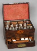 A 19th century rosewood apothecary cabinet 
The fitted interior enclosing various bottles, scales,
