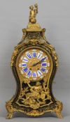 A boulle bracket clock and bracket
Both typically worked with brass inlay, the segmented porcelain