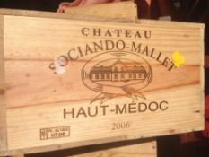 Chateau Sociando-Mallet Haut-Medoc 2006
Twelve bottles in old wooden case.  (12)   CONDITION