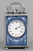 A Swiss silver and enamel cased miniature repeating carriage clock
The white dial with Roman