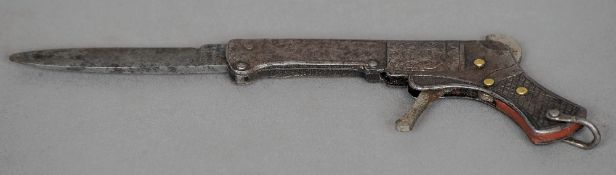 A 19th century German penknife
The casing formed as a pistol, the trigger springing the release