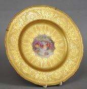 A Royal Worcester gilt and hand painted porcelain cabinet plate
The central panel painted with