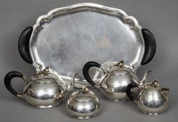 An early 20th century Italian Art Deco silver four piece tea set and tray, lozenge mark with