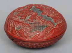 A 19th century Chinese cinnabar lacquered box and cover
Of domed circular form, decorated with