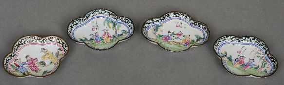 Four 19th century Canton enamel dishes
Each of quatrefoil form, decorated with various figures and