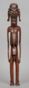 A carved hardwood tribal figure, possibly Easter Island
Formed as an emaciated male figure, the