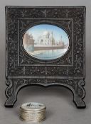 A 19th century Indian miniature on ivory depicting the Taj Mahal
Housed in an ornately carved frame;