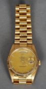 An 18 ct gold Rolex Oyster day/date chronometer wristwatch
The circular dial with Roman numerals and