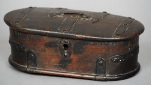 An 18th/19th century iron bound wooden box
The hinged oval lid with iron strapwork and a loop