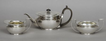 An Art Deco three piece silver tea set, hallmarked Sheffield 1922, maker's mark of James Dixon &