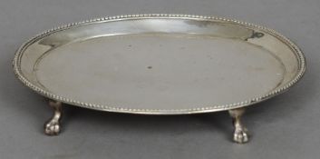 A George III silver teapot stand, hallmarked London 1781, maker's mark of RR
Of beaded oval form,