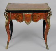 A 19th century gilt bronze mounted boulle card table
The hinged swivelling rectangular top enclosing