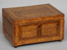 A 19th century parquetry inlaid walnut box
With allover geometric decoration, the interior fitted