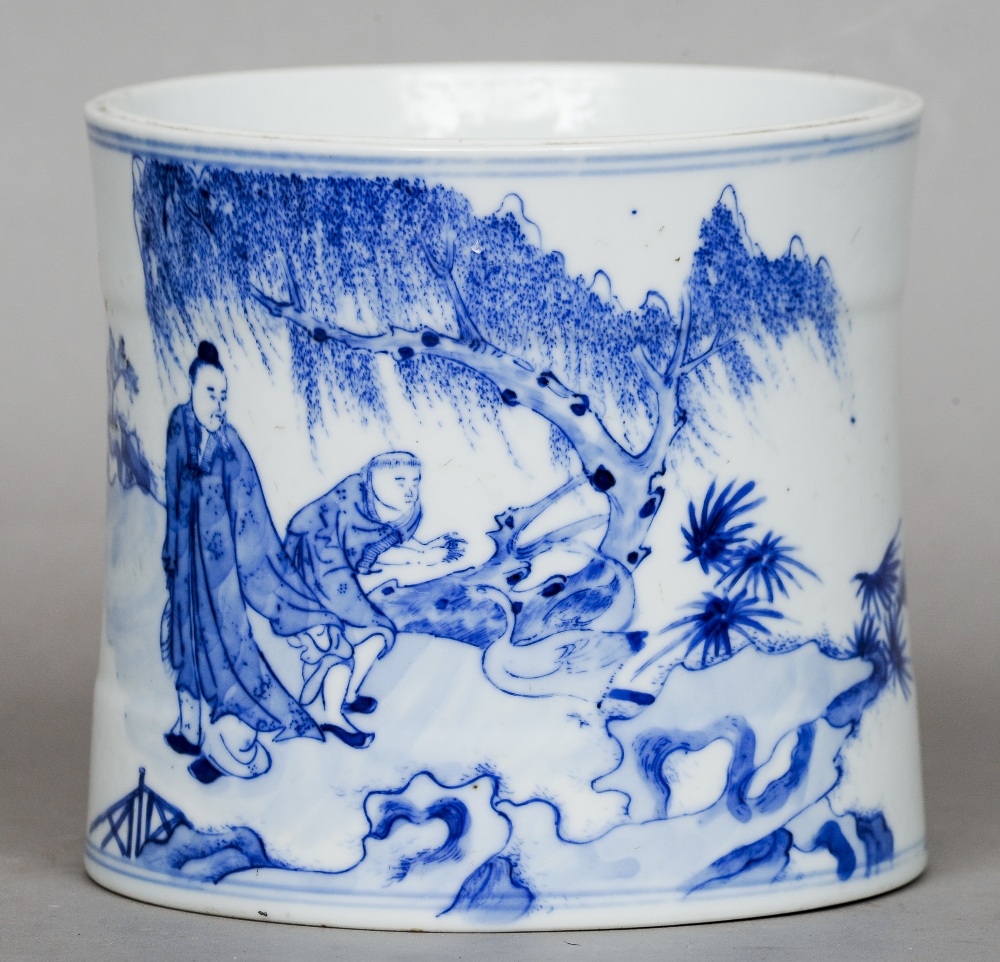 An 18th/19th century Chinese blue and white porcelain brush pot
Of banded cylindrical form, the