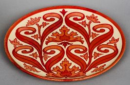 A Maw & Co. Ltd. lustre ware pottery charger
Decorated with scrolling leaf, painted marks to verso.