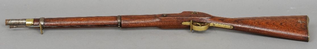 A 19th century percussion cap musket
Of typical form, with brass mounts.  98 cms long.   CONDITION