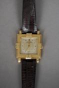 An Art Deco 14 ct gold cased Longines wristwatch
The signed square dial with baton markers and