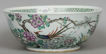 A Chinese Kangxi porcelain famille verte punch bowl
Decorated to the exterior with various birds