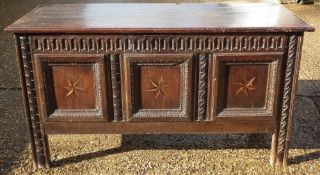 A 17th century oak panelled coffer
Of carved and inlaid decoration.  161 cms wide.   CONDITION