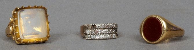An unmarked gold and diamond ring
Set with three bands of diamonds; together with an unmarked gold