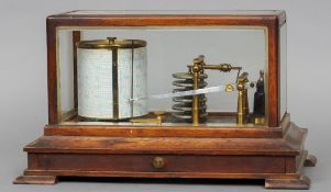 A late 19th century barograph
Housed in a glazed oak case with a frieze drawer.  37 cms wide.