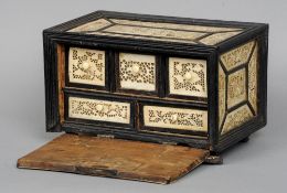 A Continental bone mounted table cabinet
Each pierced and carved panel depicting exotic birds and