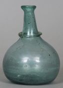 A pale blue glass bottle, Iran, Shiraz, 18th century
Of onion form with a ring mounted neck.  13 cms