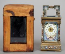 A small 19th century cloisonne decorated brass carriage clock
The main body cornered with Corinthian