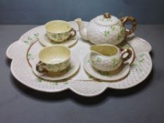 A second mark period (1891-1926) Belleek porcelain tea set
Of typical basket weave form with