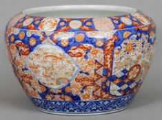 A large Japanese Imari porcelain jardiniere
Typically decorated with vignettes of various birds