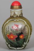 A Chinese reverse painted glass snuff bottle
Decorated with vignettes of fish, one side signed.  6.5
