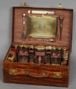 An Edwardian crocodile skin gentleman's travelling case
Extensively fitted with silver gilt and