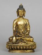 An Oriental gilt bronze model of Buddha
Typically modelled seated in the lotus position holding a