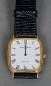 A yellow metal cased Baume & Mercier gentleman's wristwatch
The canted square dial with Roman