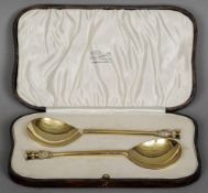 A pair of silver gilt seal top apostle spoons, hallmarked London 1923, maker's mark of Finnigans