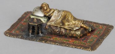 An Austrian cold painted model of a reclining female
The removable blanket revealing her naked body.