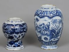 An 18th/19th century Dutch Delft vase
Decorated in blue and white with various figures amongst