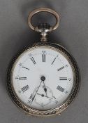 A niello worked white metal cased pocket watch by Longines
The white enamelled dial with Roman and